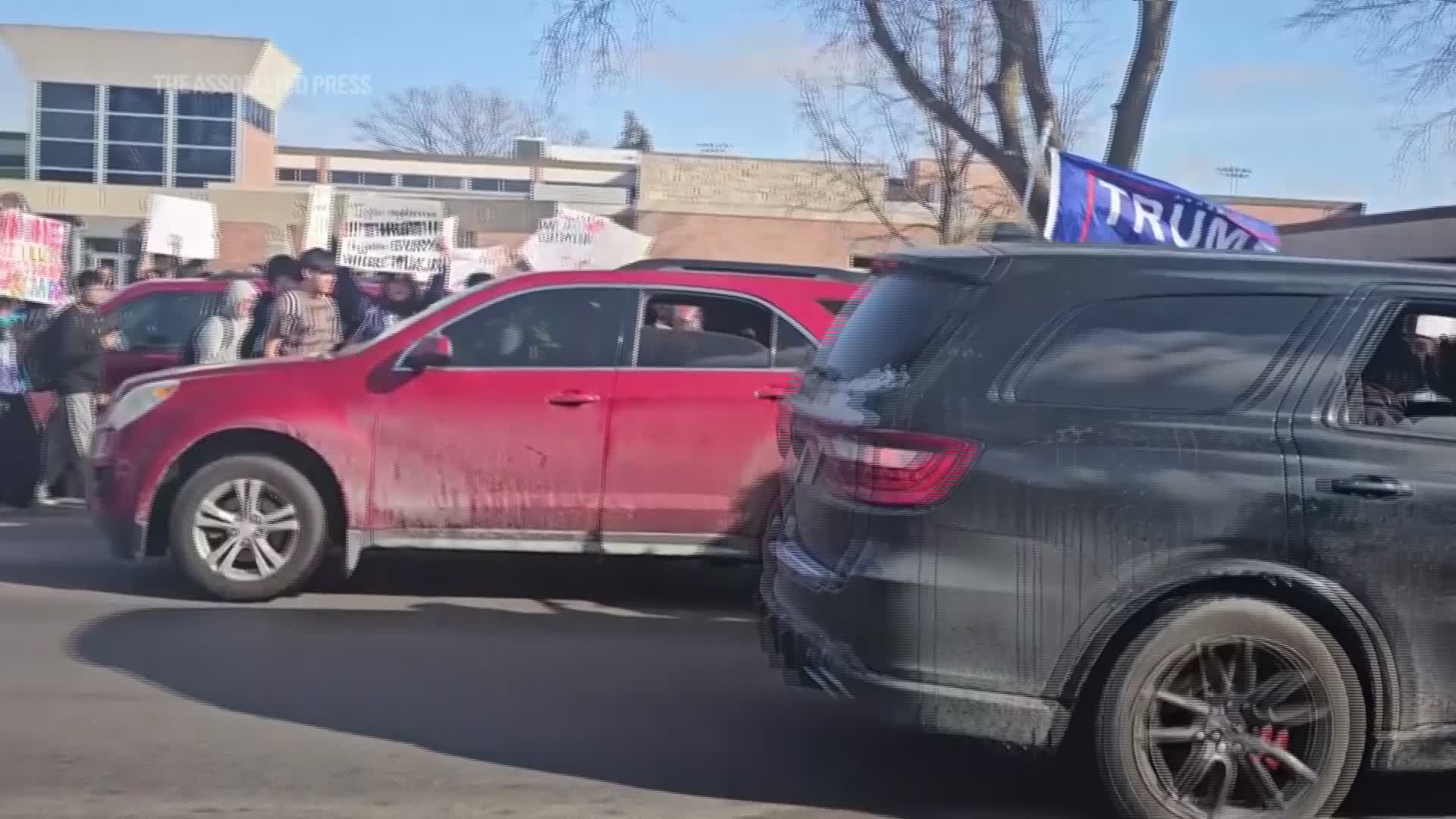 Car hits student during an anti-ICE protest outside a Nebraska high ...